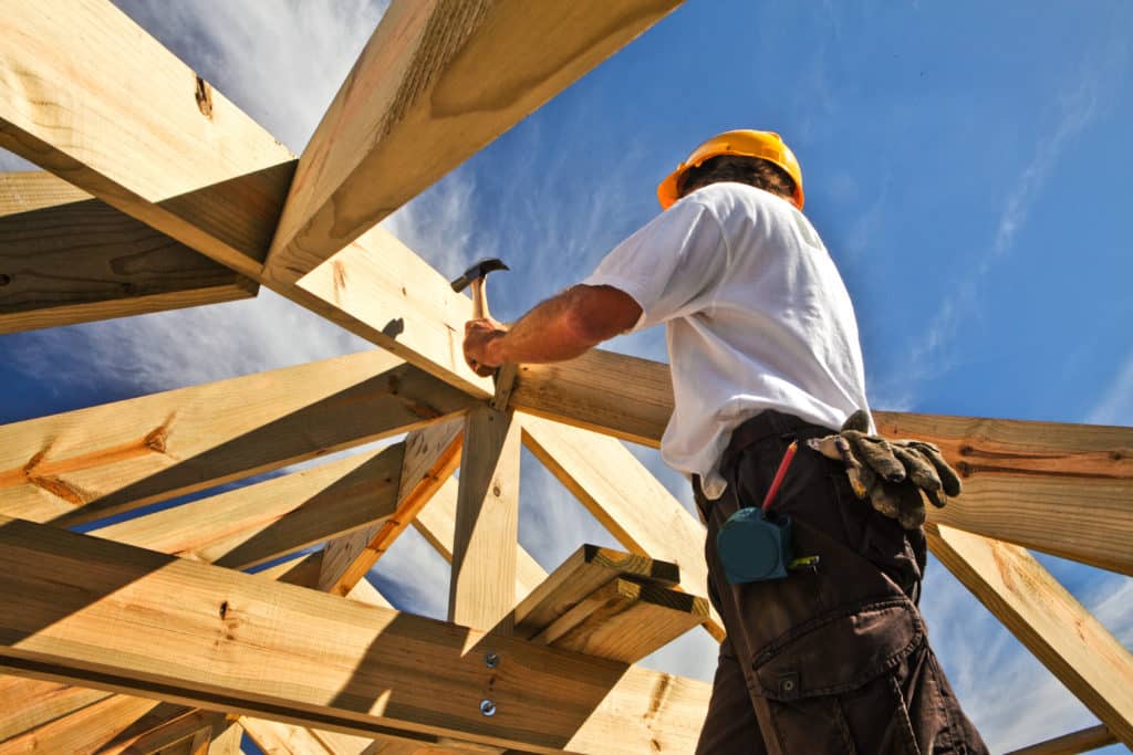 construction contractor working on frame for house