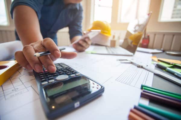 construction contractor using calculator