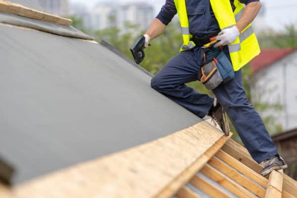 Roofing contractor on roof