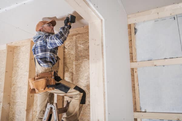 drywall contractor working on job