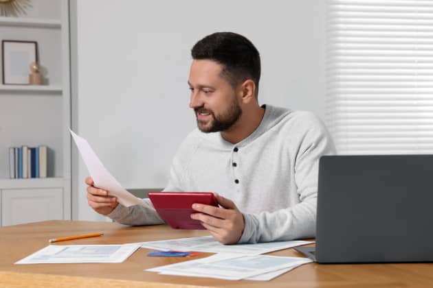 man calculating taxable income