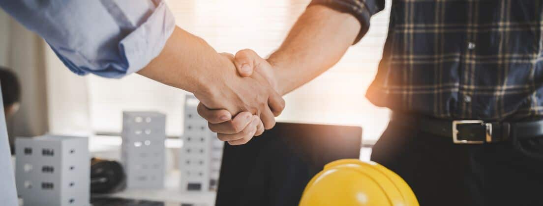 shaking hands after hiring contractor