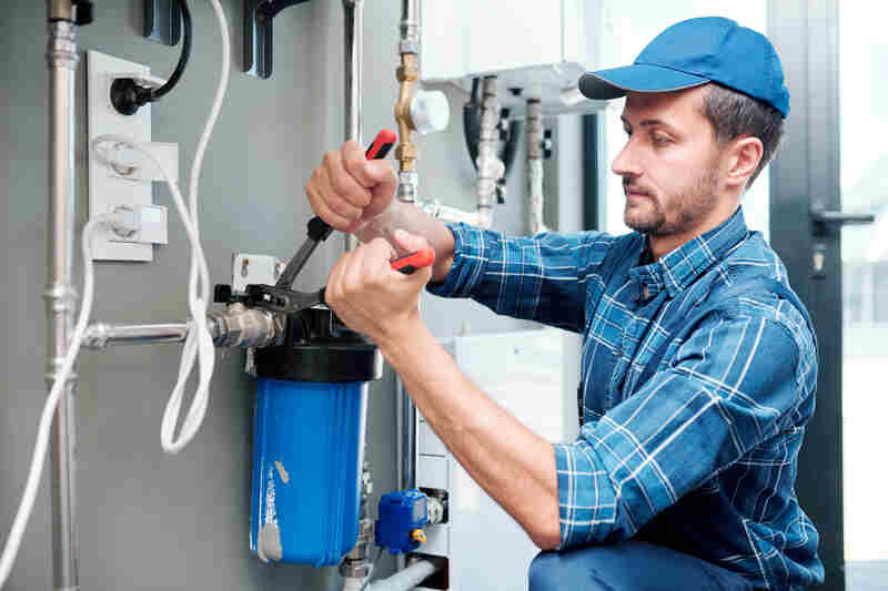 Professional plumber repairing system of water filtration