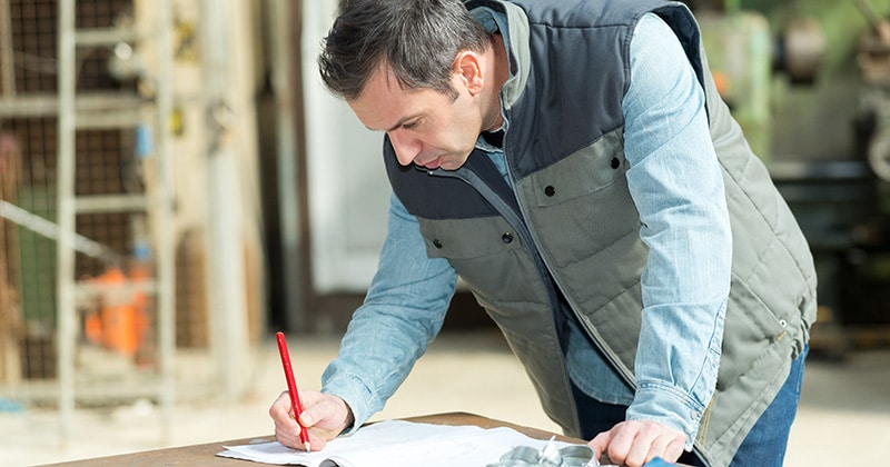 Home contractor taking notes