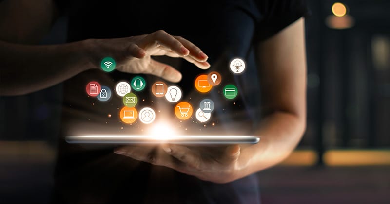 Person with hand over tablet, displaying digital marketing concept