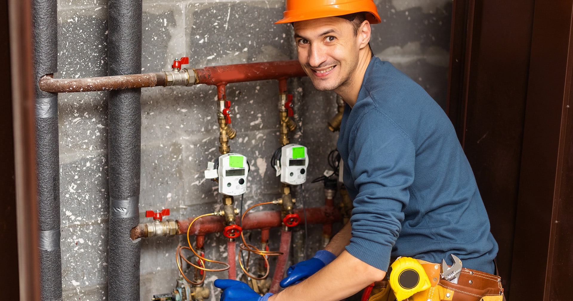 Plumber installing pressure meter
