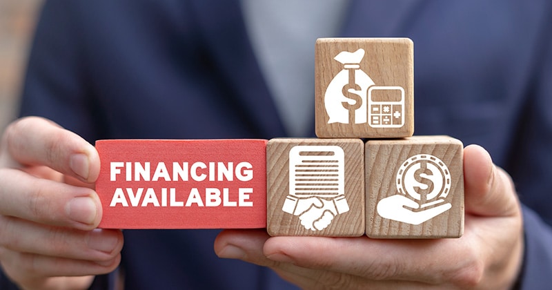 Business concept on wooden blocks of financing available