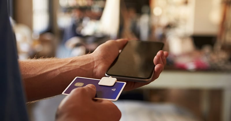 Credit card reading device attached to mobile phone