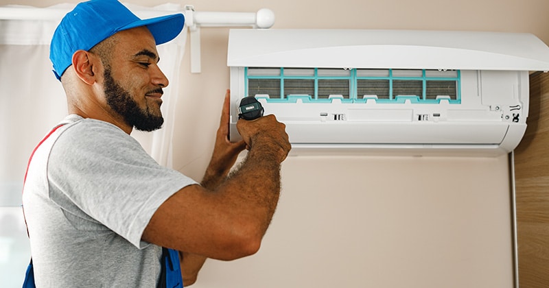 HVAC repairman at work in home