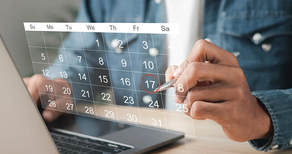 Hands working with calendar on the virtual screen interface