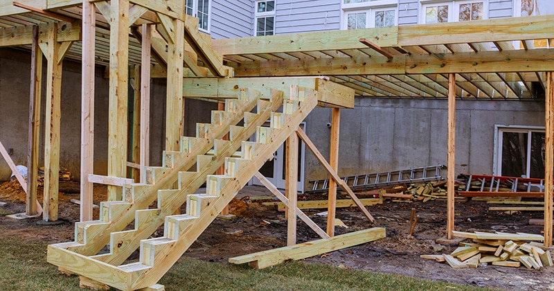 Installing deck boards with above ground deck construction