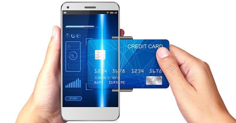 Mobile payment concept, hands holding smartphone and credit card