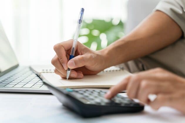 small business owner calculating time and a half